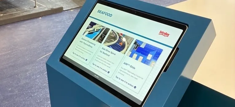 Intralox booth at trade show with Surface Pro kiosks